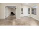 Living room featuring neutral walls, tile flooring, and an open doorway to another room at 445 W Gary Ave, Gilbert, AZ 85233