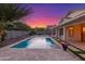 Sparkling backyard pool featuring water fountains with travertine tile and flower accents at 445 W Gary Ave, Gilbert, AZ 85233