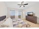 Cozy bedroom with a patterned bedspread and curtains, offering a relaxing space at 45734 W Sky Ln, Maricopa, AZ 85139