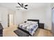 Bedroom featuring a comfy bed with bedside tables and soft carpeting at 45734 W Sky Ln, Maricopa, AZ 85139