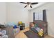 Comfortable bedroom with a crib, soft lighting, and neutral decor, creating a cozy space at 45734 W Sky Ln, Maricopa, AZ 85139