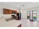 Bright kitchen area with breakfast bar and modern appliances at 45734 W Sky Ln, Maricopa, AZ 85139