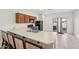 Bright kitchen area with breakfast bar and modern appliances at 45734 W Sky Ln, Maricopa, AZ 85139