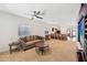 Open-concept living room with seamless flow into kitchen area at 45734 W Sky Ln, Maricopa, AZ 85139