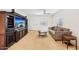 Comfortable living room with neutral tones, ceiling fan, and cozy seating at 45734 W Sky Ln, Maricopa, AZ 85139