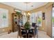 Charming dining area with chandelier and elegant furnishings at 4662 E Blue Spruce Ln, Gilbert, AZ 85298