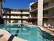 Beautiful community pool with lounge chairs and landscaped surroundings for residents to enjoy at 4727 E Lafayette Blvd # 117, Phoenix, AZ 85018