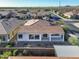 A home's back exterior with a covered patio and an immaculate zero-scaping backyard at 500 E Watermelon Ln, Queen Creek, AZ 85140