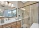 Bright bathroom featuring a glass enclosed shower, and a single vanity sink at 500 E Watermelon Ln, Queen Creek, AZ 85140