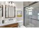 This bathroom features a glass enclosed shower, toilet, and a vanity sink at 500 E Watermelon Ln, Queen Creek, AZ 85140