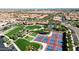 Great aerial view of community amenities: tennis courts, a pool, and green spaces in a serene setting at 500 E Watermelon Ln, Queen Creek, AZ 85140