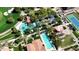 Aerial of a luxury community pool area, complete with palm trees, lounge chairs, and resort-style amenities at 500 E Watermelon Ln, Queen Creek, AZ 85140