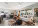 Bright living room with an open floor plan featuring a kitchen, dining area, and seamless indoor-outdoor living at 5140 E Desert Forest Trl, Cave Creek, AZ 85331