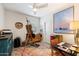 Bright home office/bedroom with natural light, artwork, and an organized workspace at 5140 E Desert Forest Trl, Cave Creek, AZ 85331