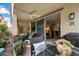 Relaxing covered patio with outdoor seating, ceiling fan, and views into the living room at 5140 E Desert Forest Trl, Cave Creek, AZ 85331