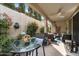 Charming covered patio featuring outdoor dining and seating areas with manicured landscaping at 5140 E Desert Forest Trl, Cave Creek, AZ 85331
