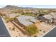 Stunning aerial view of desert home with brick driveway, lush landscaping and mountain views at 6208 E Lonesome Trl, Cave Creek, AZ 85331