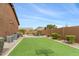 Expansive backyard featuring manicured lawn, privacy fence, and mountain views at 6208 E Lonesome Trl, Cave Creek, AZ 85331