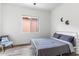 Bright bedroom with wood-look tile flooring, a comfortable bed, and a calming atmosphere at 6208 E Lonesome Trl, Cave Creek, AZ 85331