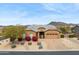 Charming single-story home with desert landscaping, beautiful flowers and mountain views at 6208 E Lonesome Trl, Cave Creek, AZ 85331