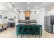 Gourmet kitchen with a large center island, pendant lighting, and stainless-steel appliances at 6208 E Lonesome Trl, Cave Creek, AZ 85331