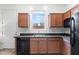 Well-lit kitchen features stainless steel appliances, sleek countertops, and warm wood cabinets at 6208 E Lonesome Trl, Cave Creek, AZ 85331