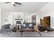 Cozy living room with a fireplace, plush sofas, and stylish decor at 6208 E Lonesome Trl, Cave Creek, AZ 85331