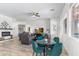 Spacious living room with fireplace, ceiling fan, and comfortable seating area at 6208 E Lonesome Trl, Cave Creek, AZ 85331