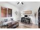 Comfortable living room with a seating area and desk, with bright lighting, suitable for relaxation or work at 6208 E Lonesome Trl, Cave Creek, AZ 85331