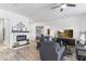 Comfortable living room with fireplace and views into other areas of the home at 6208 E Lonesome Trl, Cave Creek, AZ 85331