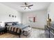 Comfortable bedroom with a ceiling fan and backyard view at 6208 E Lonesome Trl, Cave Creek, AZ 85331