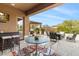 Inviting covered patio featuring an outdoor dining area and comfortable seating for entertaining guests at 6208 E Lonesome Trl, Cave Creek, AZ 85331