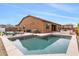 Expansive backyard with a sparkling pool, lounge chairs, and meticulously landscaped surroundings at 6208 E Lonesome Trl, Cave Creek, AZ 85331