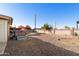 Large gravel backyard with a hot tub and ample space for outdoor activities at 6646 E Dodge St, Mesa, AZ 85205