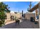 Private backyard with desert landscaping, seating area, shed, and block wall for seclusion at 7807 E Main St # Cc-85, Mesa, AZ 85207