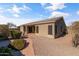 Exterior view of home's backyard with desert landscaping at 8117 E Sweet Bush Ln, Gold Canyon, AZ 85118