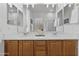 Bathroom with double sinks, a large mirror, and a soaking tub for a refreshing and relaxing bathing experience at 8117 E Sweet Bush Ln, Gold Canyon, AZ 85118