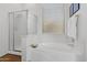 Bathroom featuring a soaking tub, a separate shower, and a window for natural light and ventilation at 8117 E Sweet Bush Ln, Gold Canyon, AZ 85118