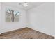 Bedroom with wood-look flooring and a ceiling fan for comfort at 8117 E Sweet Bush Ln, Gold Canyon, AZ 85118