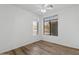 Bright bedroom with neutral walls, ceiling fan, and wood-look floors at 8117 E Sweet Bush Ln, Gold Canyon, AZ 85118