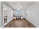 Spacious room featuring built-in desk, wood-look floors, and a ceiling fan at 8117 E Sweet Bush Ln, Gold Canyon, AZ 85118