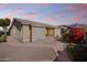 This single-story home features desert landscaping, a tile roof, and a neutral stucco exterior, blending with the Arizona landscape at 8117 E Sweet Bush Ln, Gold Canyon, AZ 85118