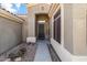 Inviting entryway with decorative glass door, stone accents, and a covered porch offering curb appeal at 8117 E Sweet Bush Ln, Gold Canyon, AZ 85118