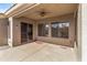 Comfortable covered patio with textured concrete and outdoor ceiling fan at 8117 E Sweet Bush Ln, Gold Canyon, AZ 85118