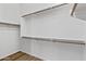 Spacious walk-in closet with ample shelving, providing plenty of storage space for clothes and accessories at 8117 E Sweet Bush Ln, Gold Canyon, AZ 85118