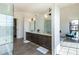 Bright bathroom features dual sinks, tile flooring, walk-in shower, and an open layout at 8510 S 9Th Dr # 20, Phoenix, AZ 85041