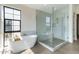 Luxurious bathroom featuring a standalone tub and glass shower, designed for relaxation at 8510 S 9Th Dr # 20, Phoenix, AZ 85041