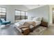 Sunlit bedroom featuring a modern platform bed and large windows at 8510 S 9Th Dr # 20, Phoenix, AZ 85041
