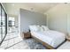 Bright bedroom with a neutral palette, featuring a modern platform bed and ample natural light at 8510 S 9Th Dr # 20, Phoenix, AZ 85041