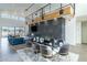 Dining area with a modern table, contemporary chairs, and open access to the living room at 8510 S 9Th Dr # 20, Phoenix, AZ 85041